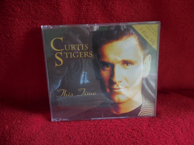 This Time includes Bonus Track I Wonder Why