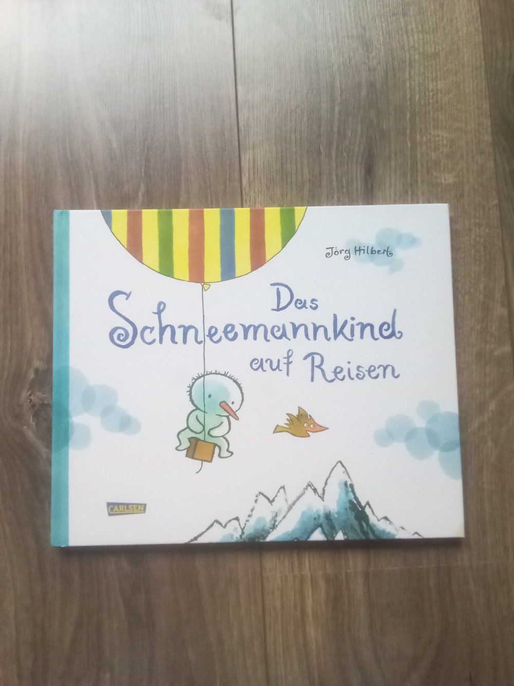Das Schneemannkind auf Reisen Bilderbuch Jörg Hilbert Carlsen
