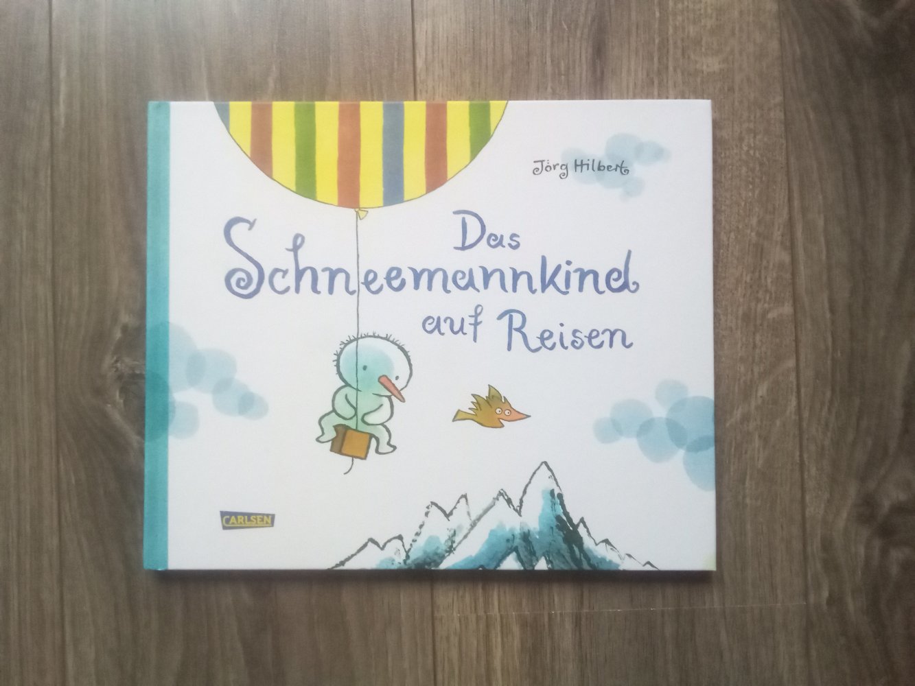 Das Schneemannkind auf Reisen Bilderbuch Jörg Hilbert Carlsen
