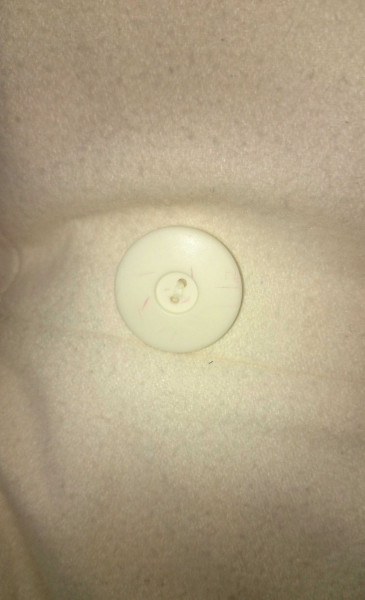 Weißer, trendiger Mantel 