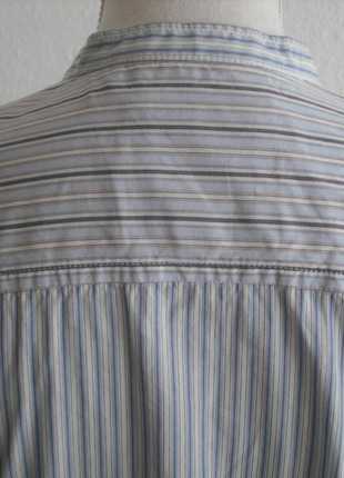 Streifenbluse im Mustermix und Rüschen