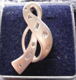 Notenschlüssel als Brosche