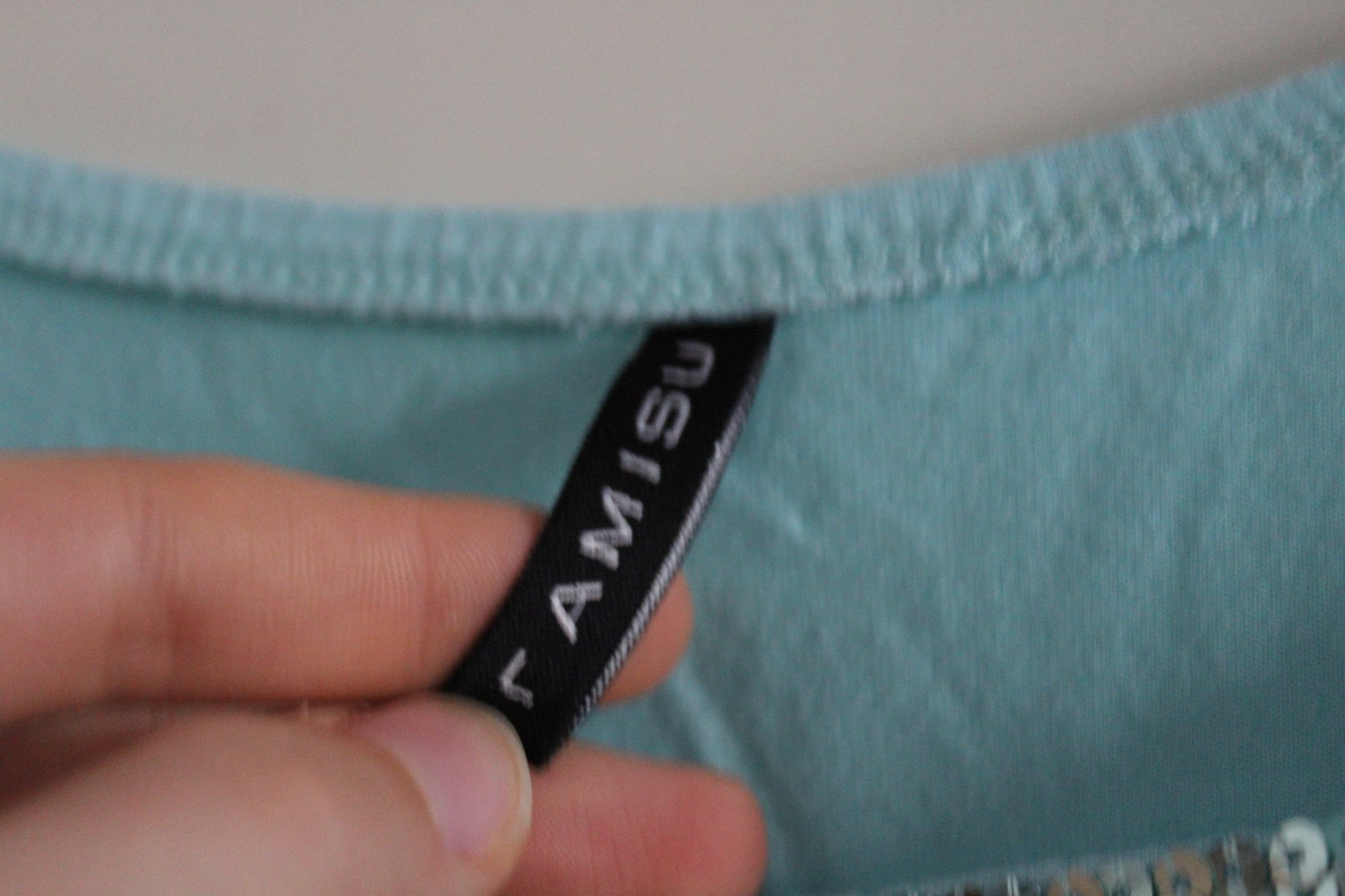 Top türkis mit Pailletten 