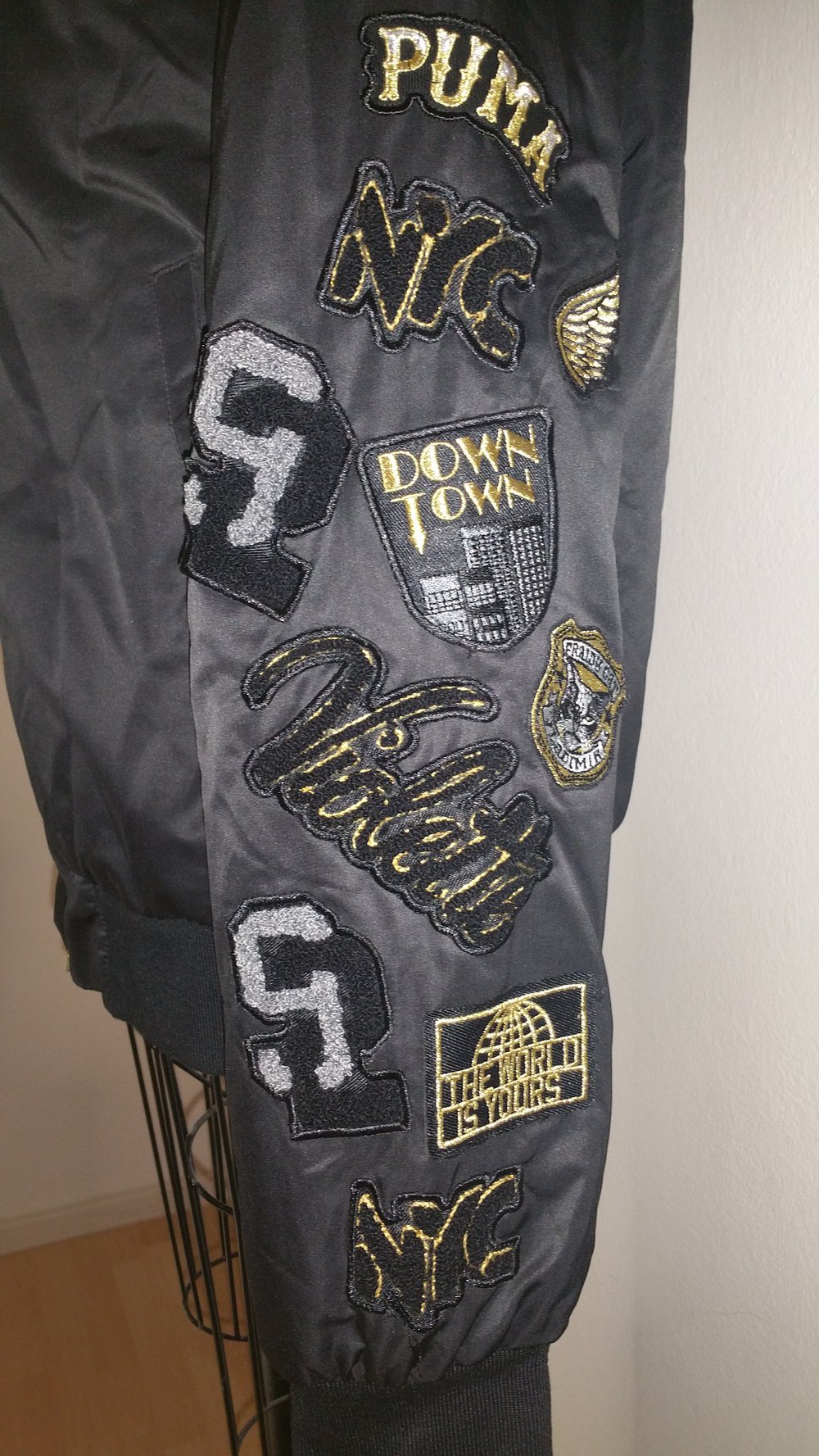 Puma Vashtie Bomberjacke, schwarz/gold