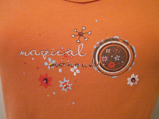 Orangefarbenes Shirt mit Dekoprint
