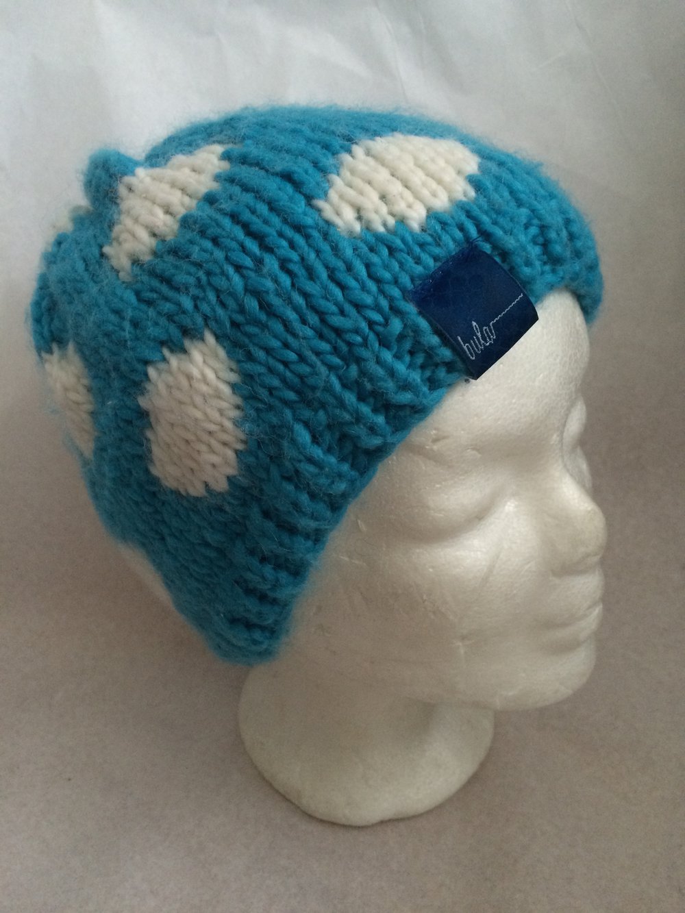 Warme Fleecestirnband Mütze in Turkis-blau mit weissen Punkten, 