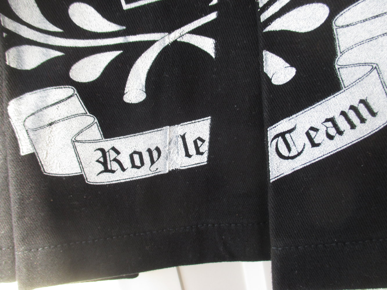 Phard; Schulmädchen Mini Rock in schwarz mit weißen Applikationen, Gr. 38, 100 % Baumwolle, neu mit Etikett