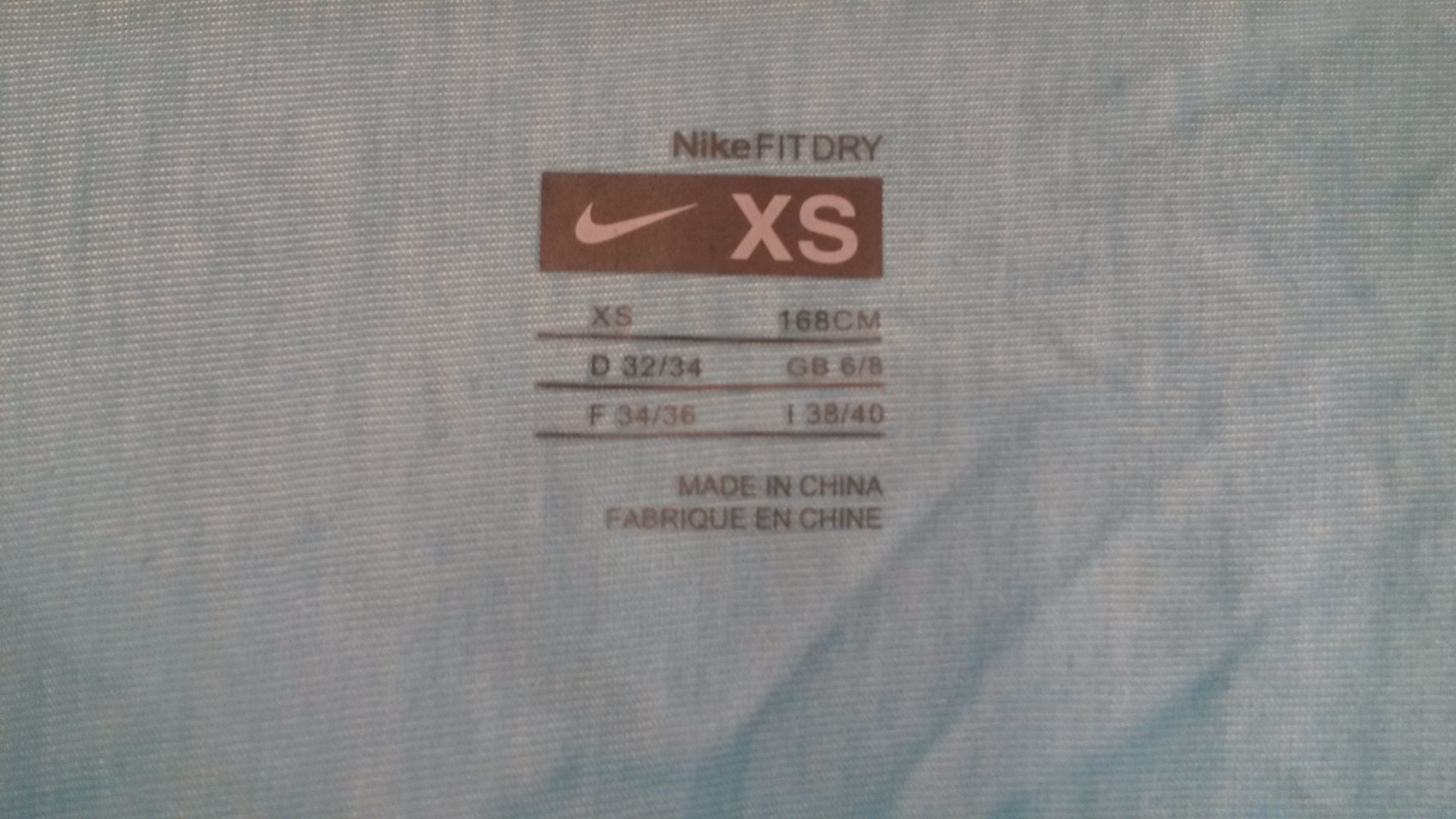 Blaues Nike T-Shirt mit Fledermausärmeln / Gerrafteärmel