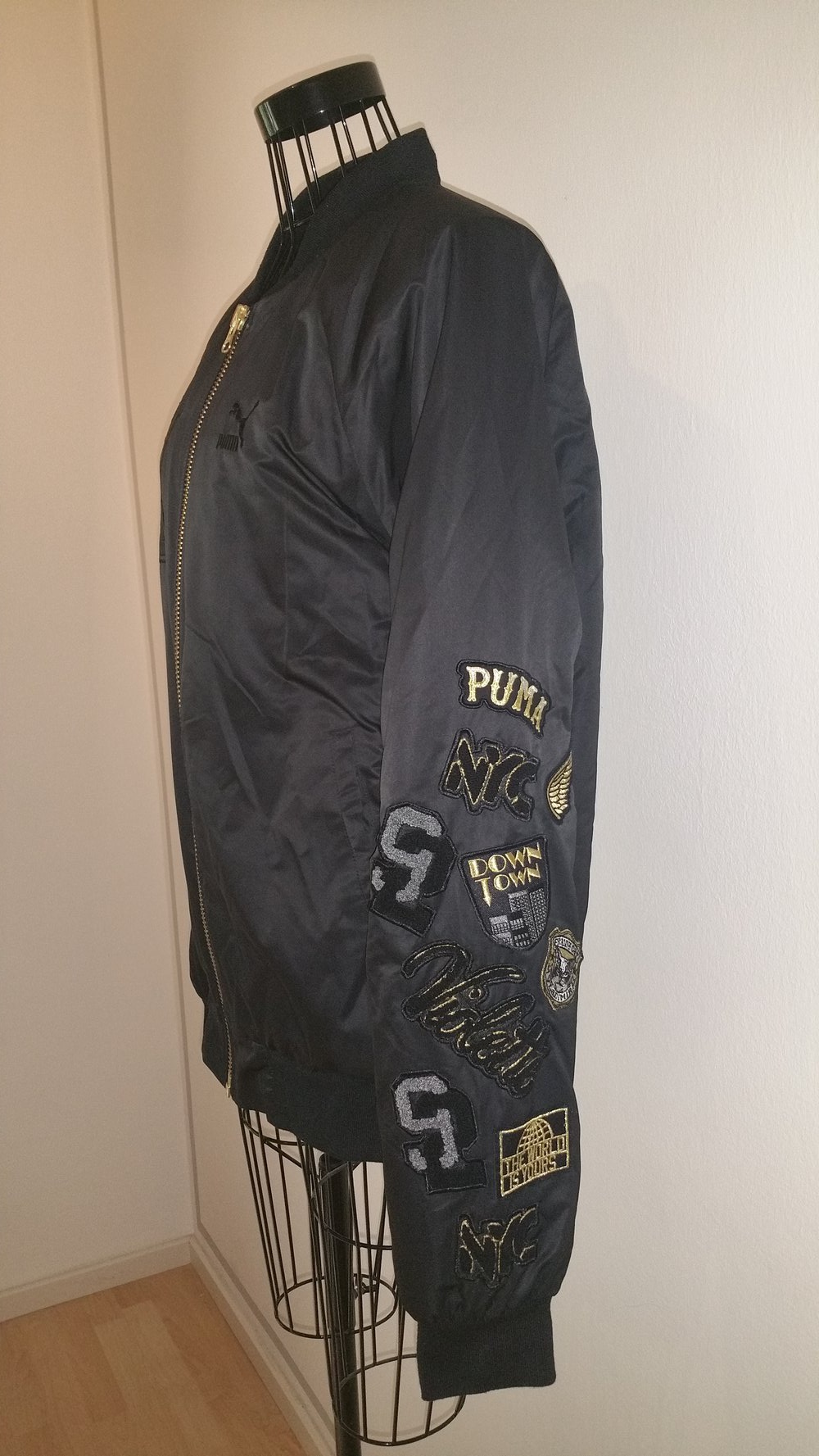 Puma Vashtie Bomberjacke, schwarz/gold