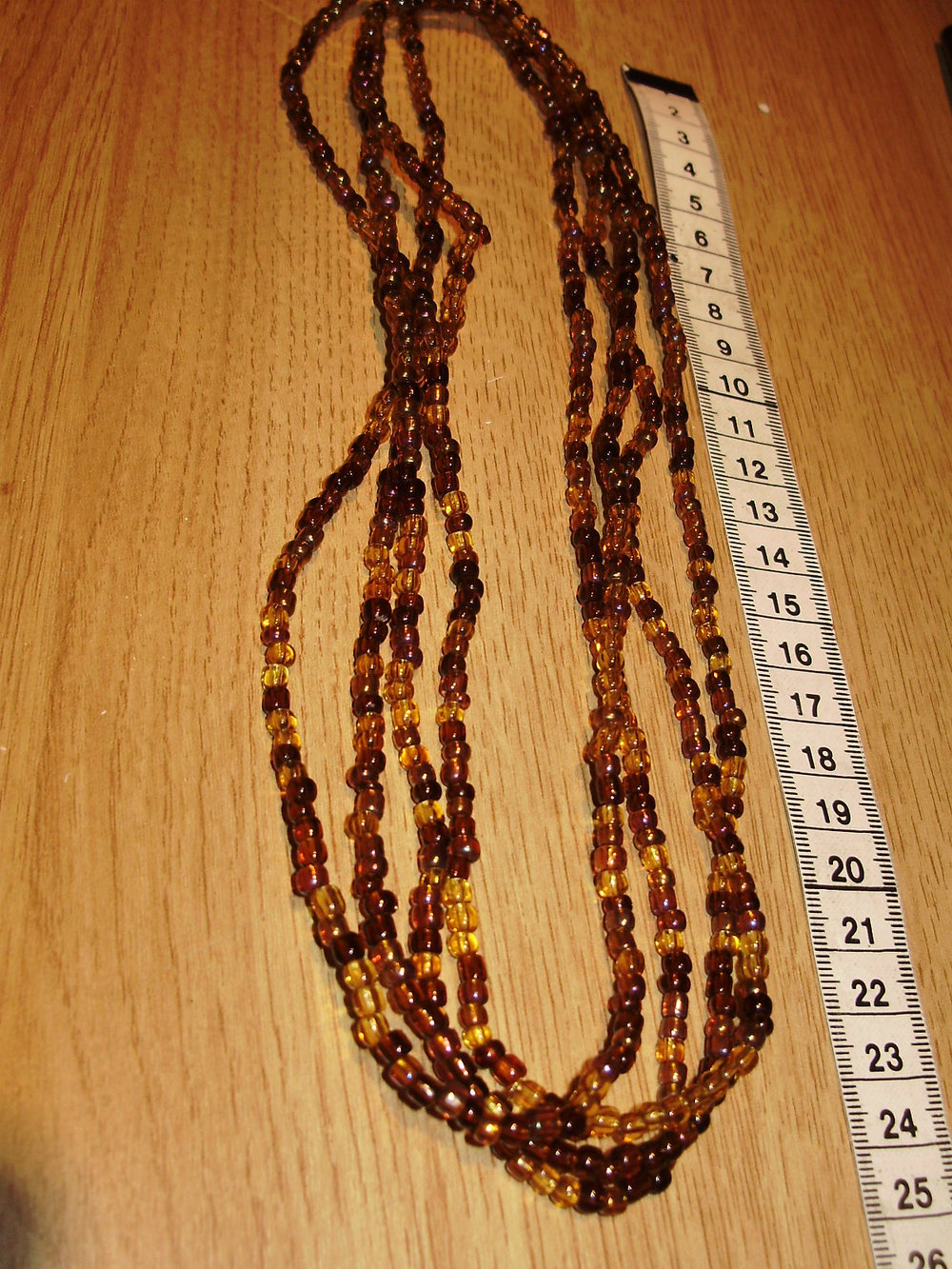 Kette sehr lang ( 214 cm) mit braunen Perlen klein wie Bernstein NEU