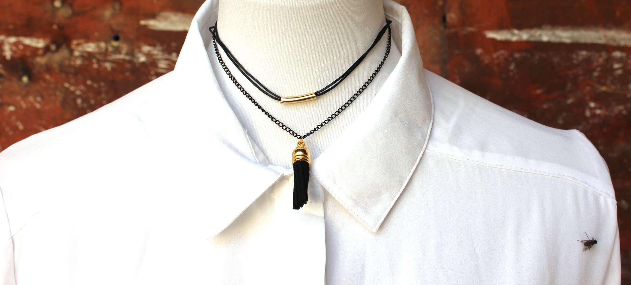 mehrreihige schwarz goldene Choker Halskette mit Bommel bzw. Quaste