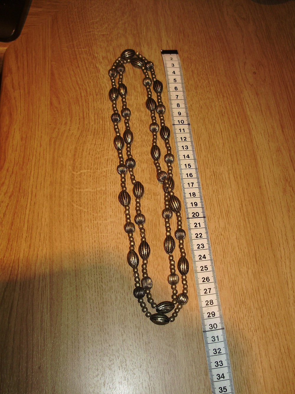 Kette lang Metallperlen bronze 114 cm