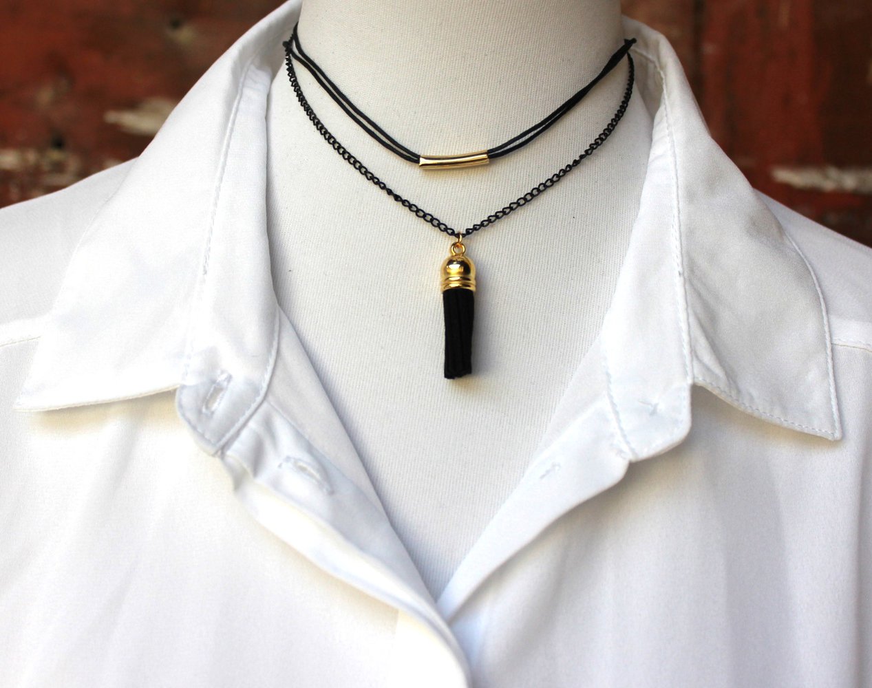 mehrreihige schwarz goldene Choker Halskette mit Bommel bzw. Quaste