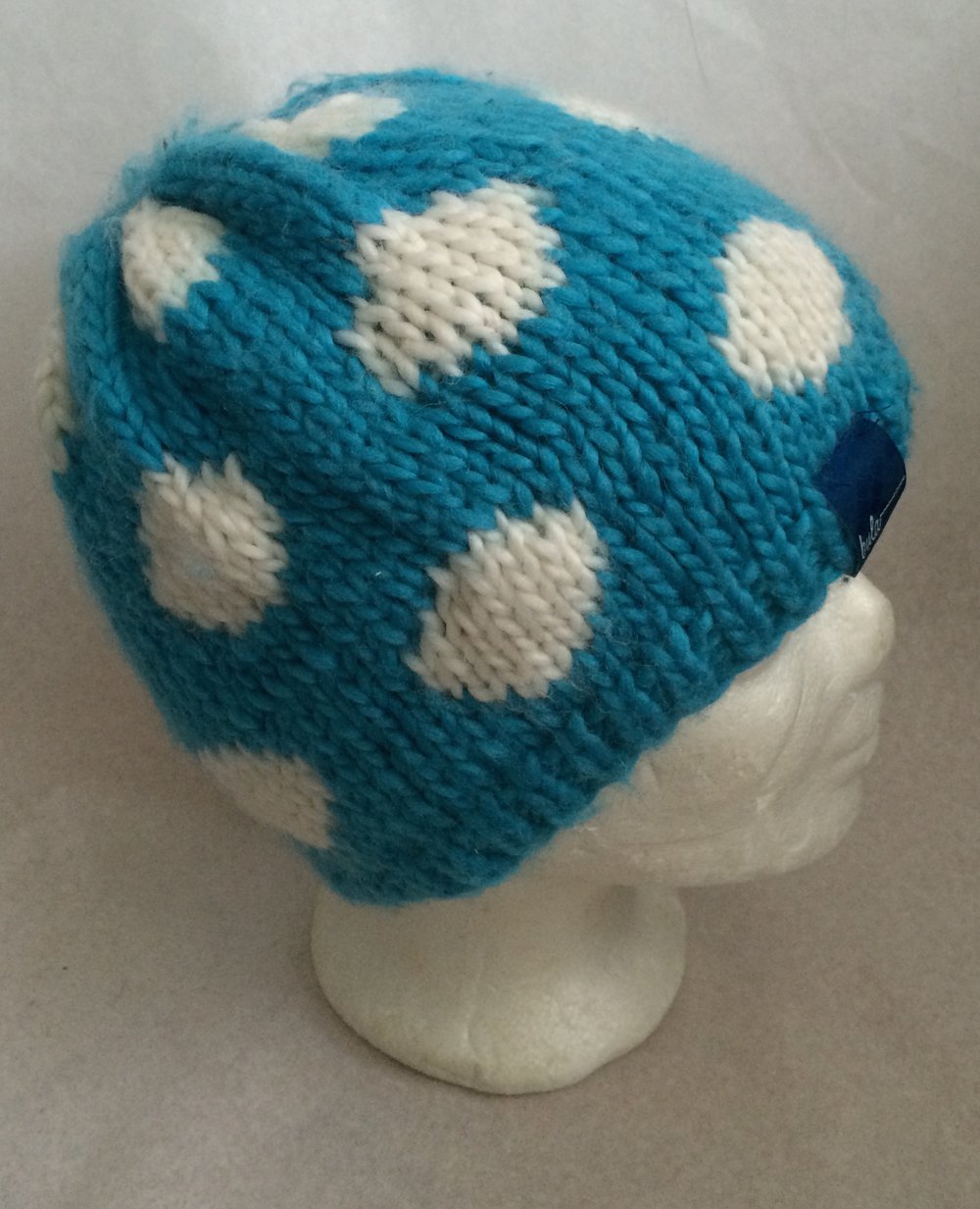 Warme Fleecestirnband Mütze in Turkis-blau mit weissen Punkten, 