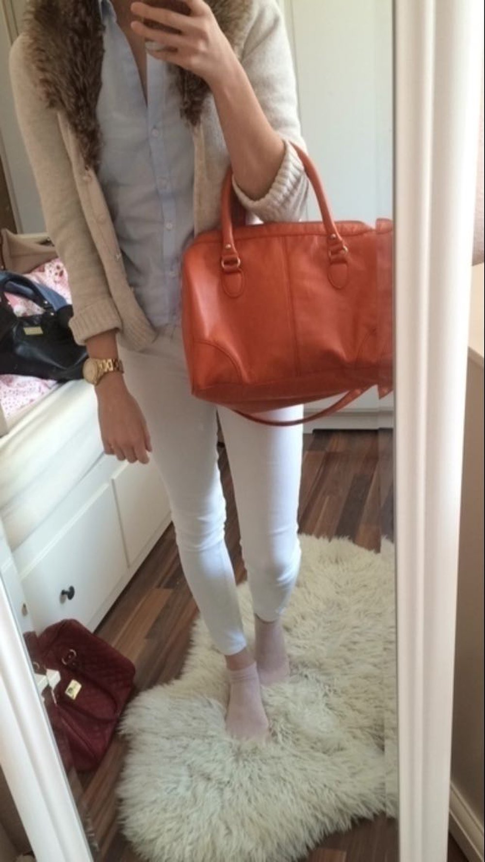 Organgene Handtasche