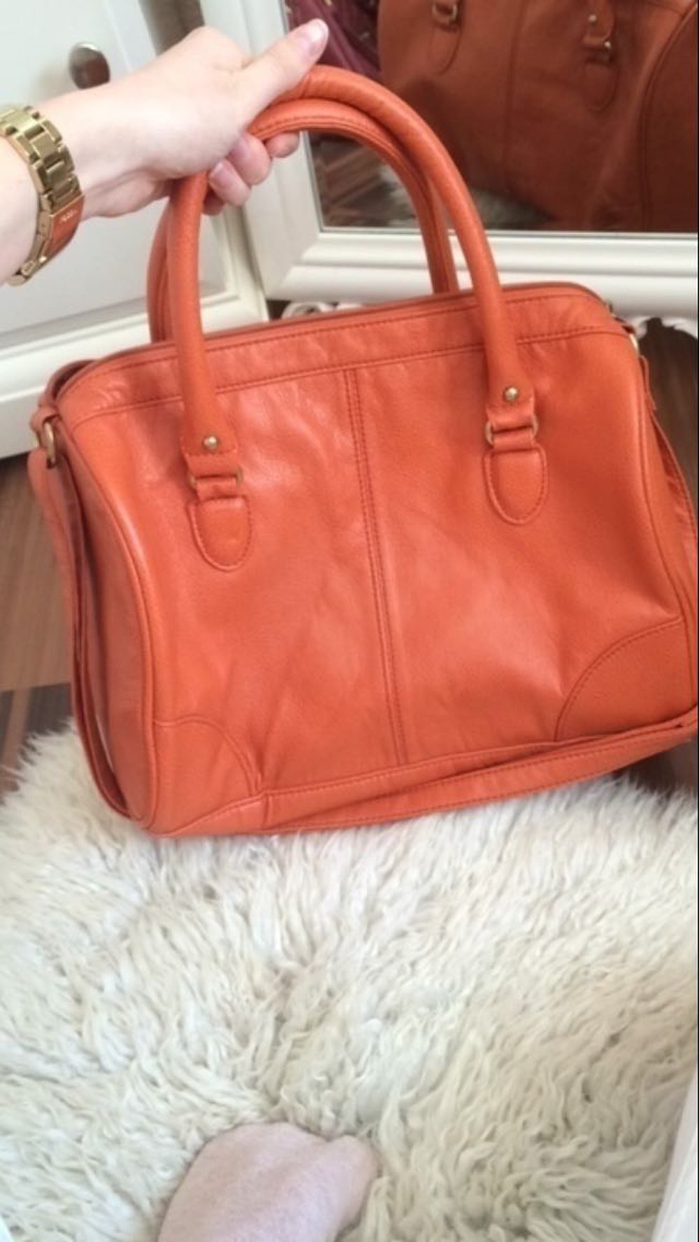 Organgene Handtasche