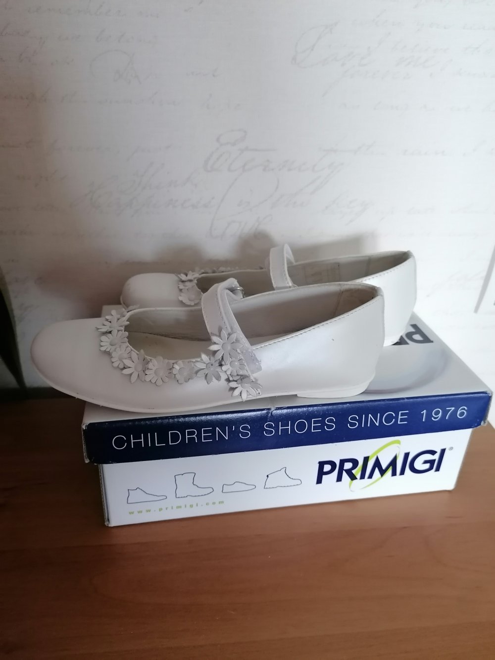 Primigi: Riemchenballerina mit Blumenapplikation, ivory Gr. 34