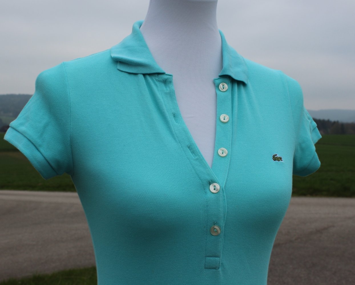 türkises Poloshirt von Lacoste, Größe 34