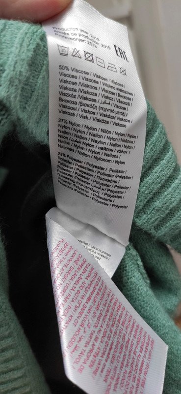 Türkiser Pullover mit Rückenausschnitt