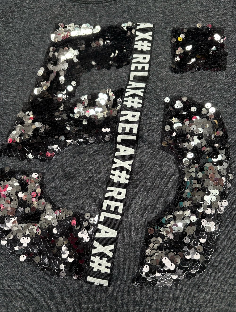 Oberteil, schwarz mit Pailletten