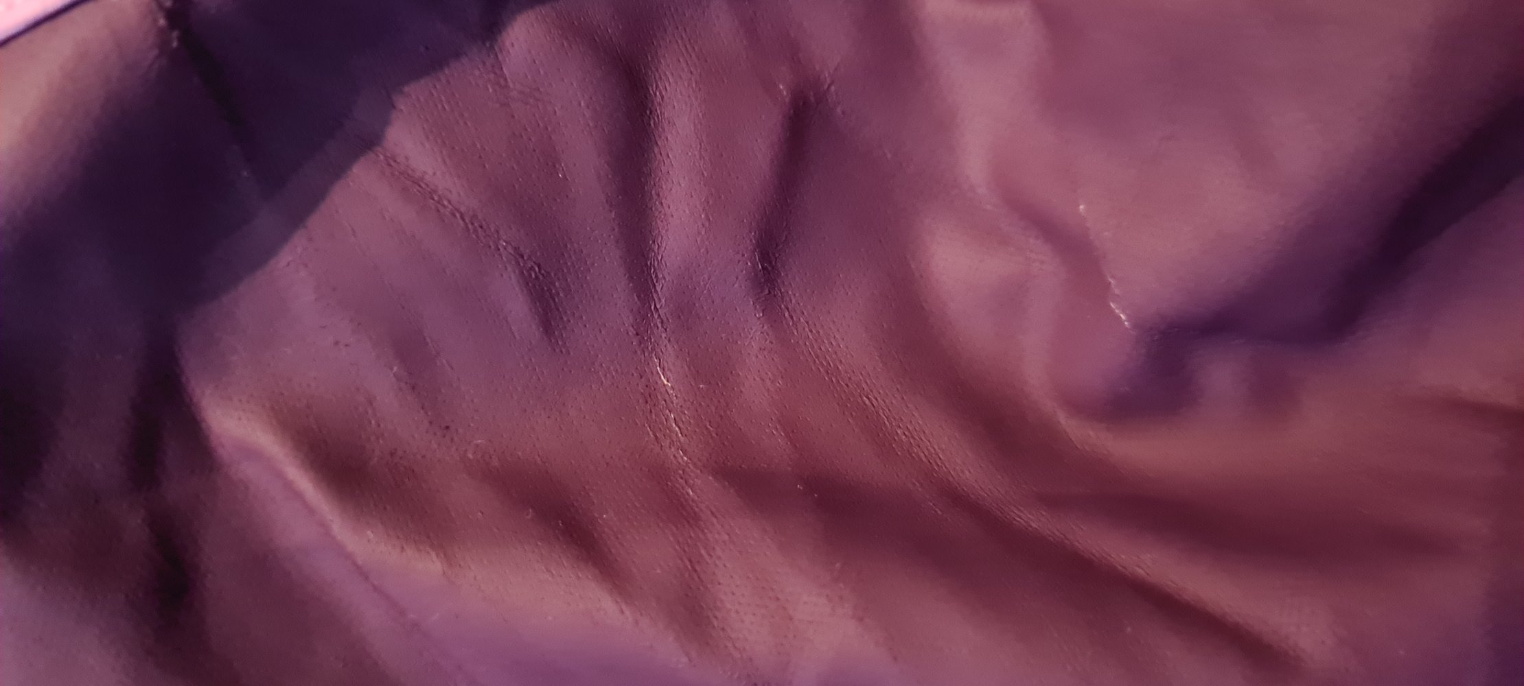 Gefütterte, lila/rosa Regenjacke von Kiki&Koko mit Kapuze und Reflektoren