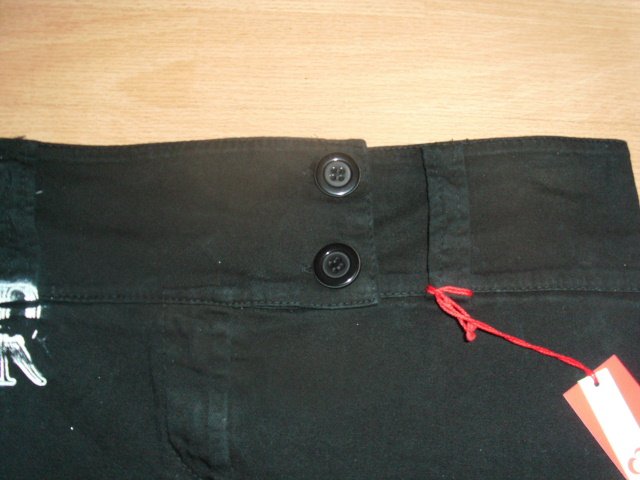 Minirock von A&M, schwarz mit Motiv, Gr. 40 mit Etikett