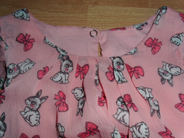 Kleid, rosa mit Motiven, Gr. 122