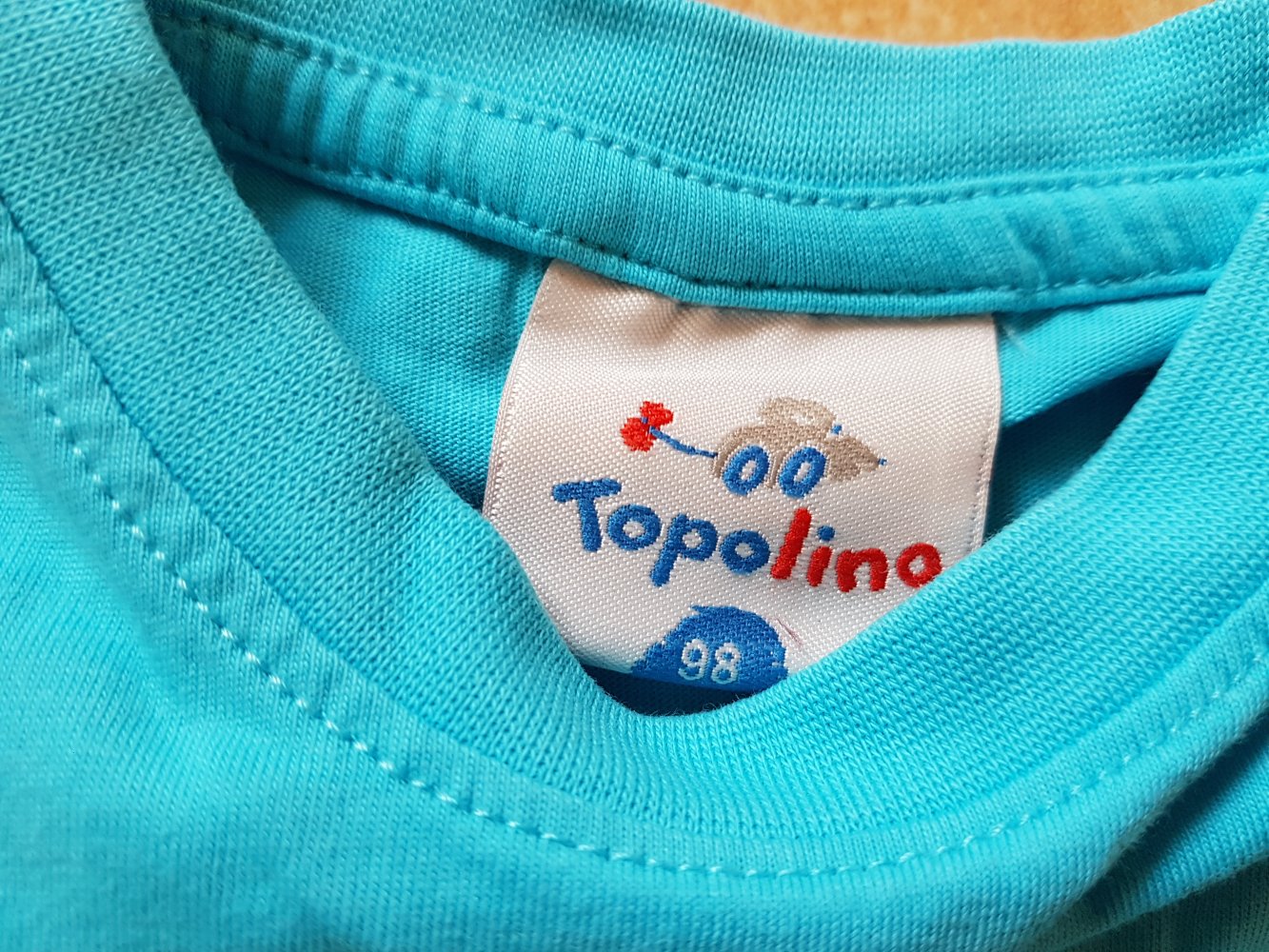 türkises Achselshirt in Gr. 98 