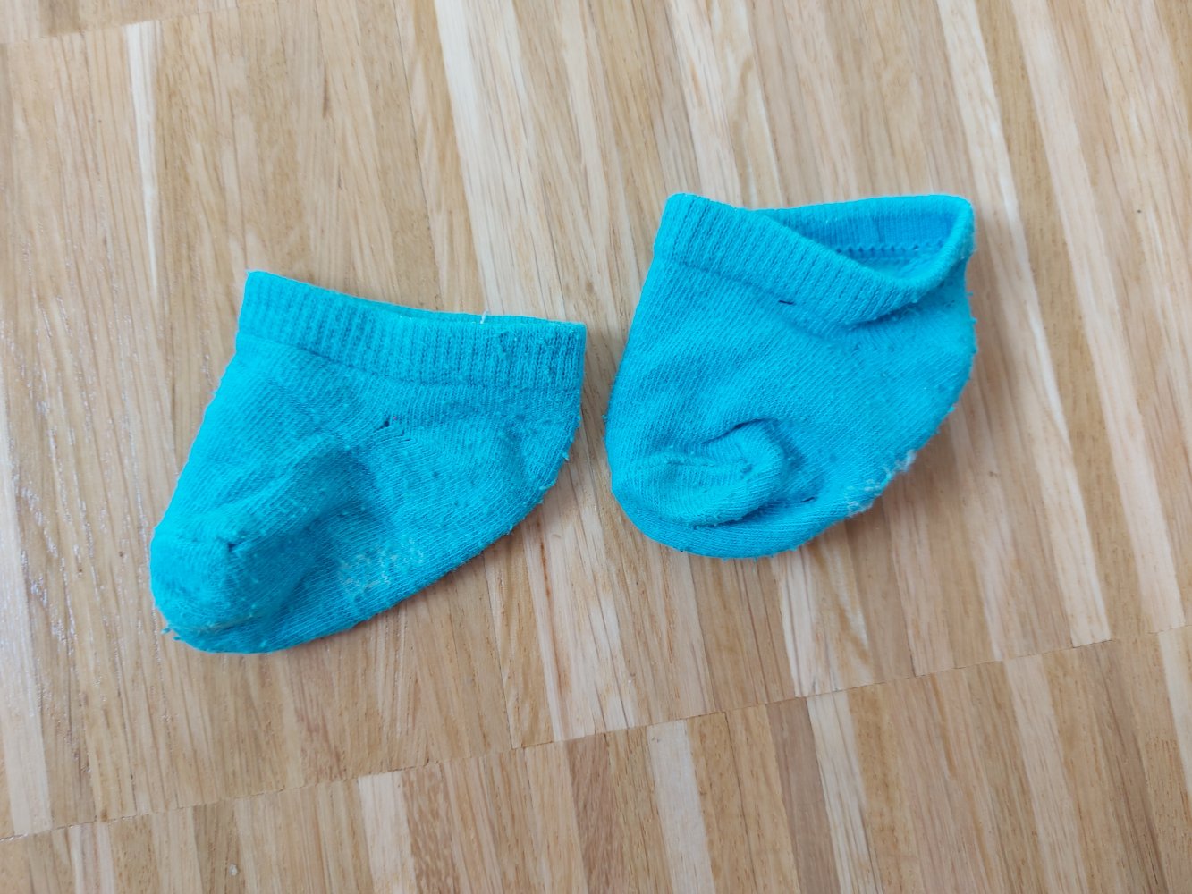 türkisfarbene Erstlingssöckchen / Babysocken
