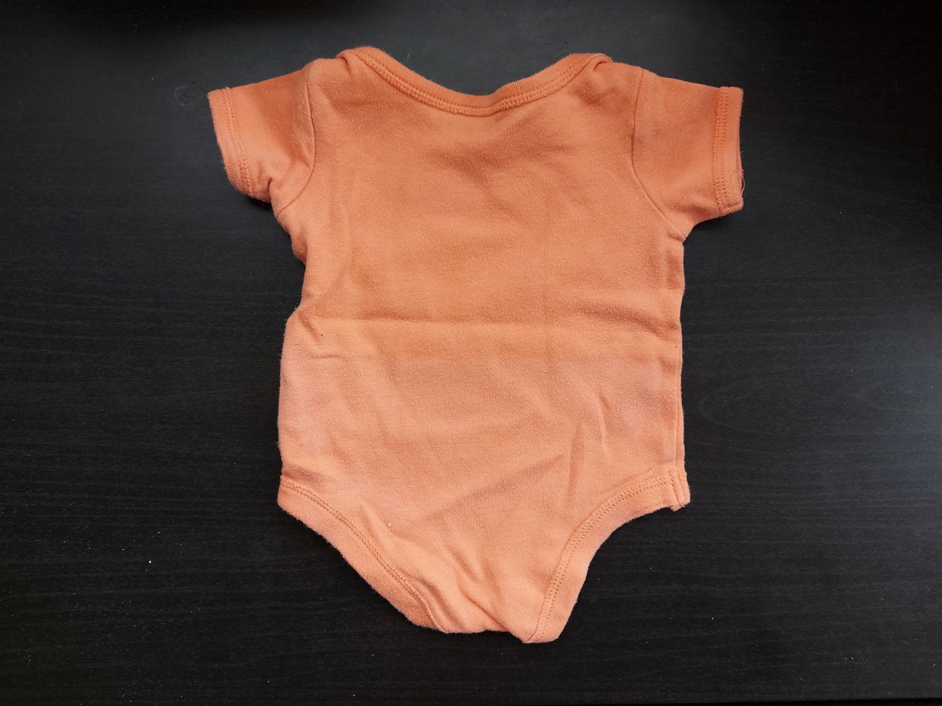Orangefarbener Kurzarmbody Little cutie Gr. 50/56