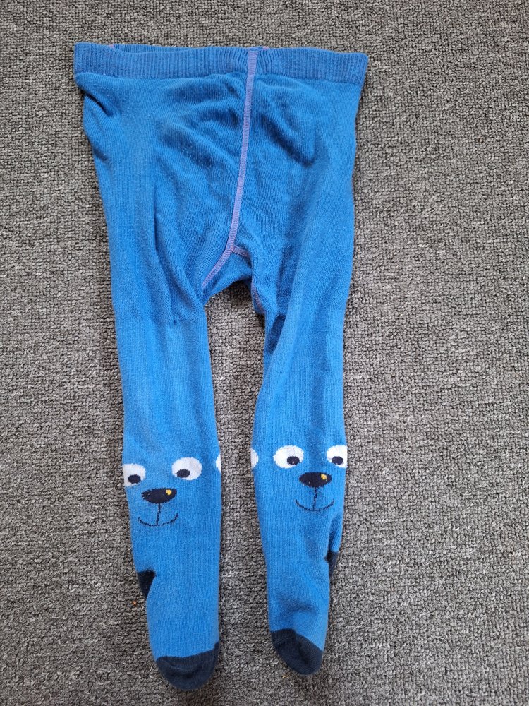 blaue Babystrumpfhose mit kleinen fröhlichen Gesichtern Gr. 74/80