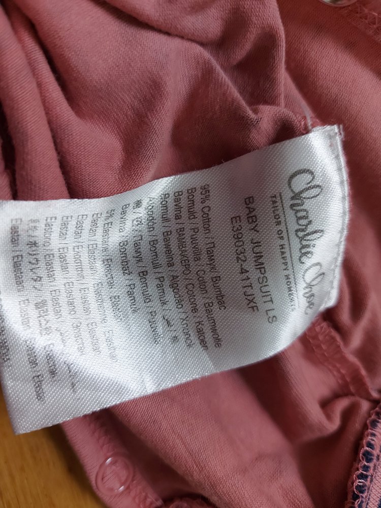 lachsfarbener Baby-Schlafanzug mit Leoprint, Gr. 62 What a day for a daydream Baby Jumpsuit