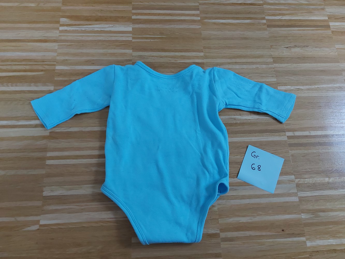 blauer Langarm-Wickelbody mit Elefantenmotiv 