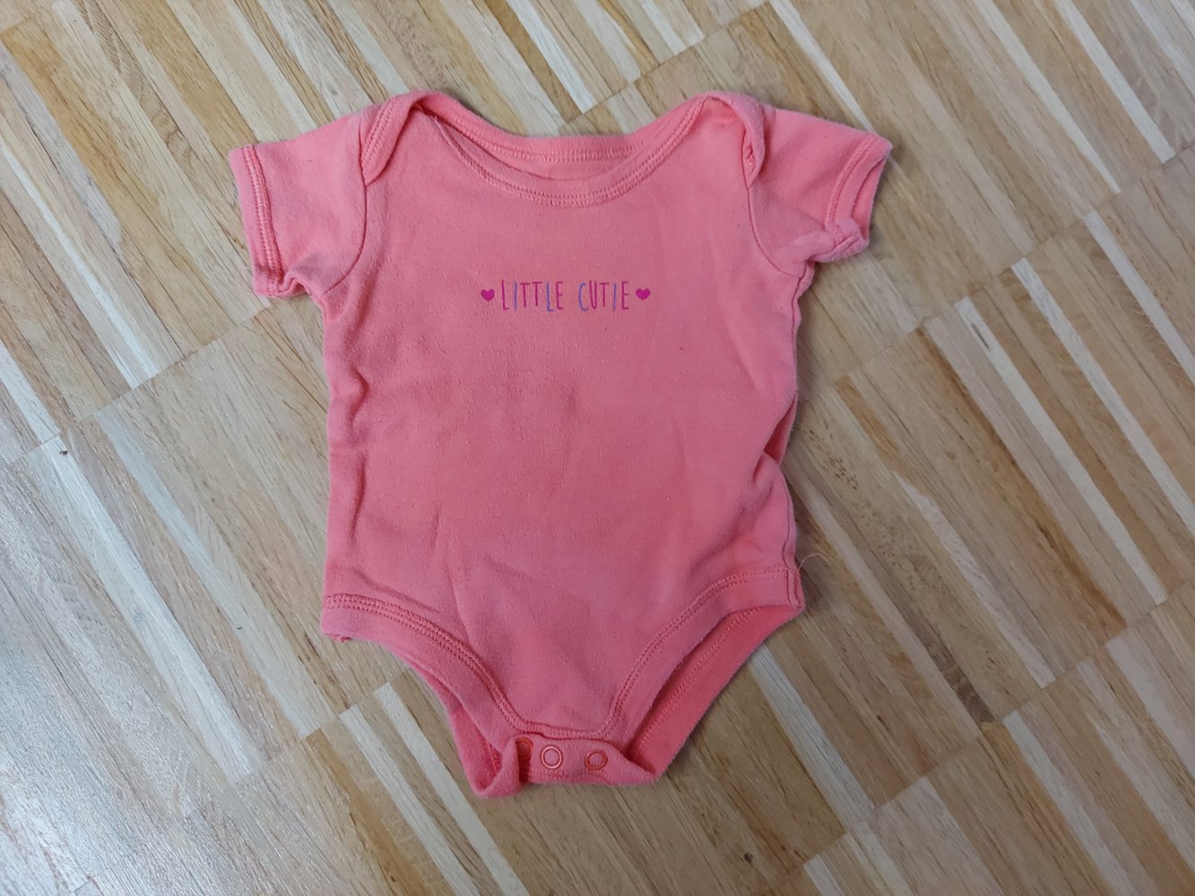 Orangefarbener Kurzarmbody Little cutie Gr. 50/56