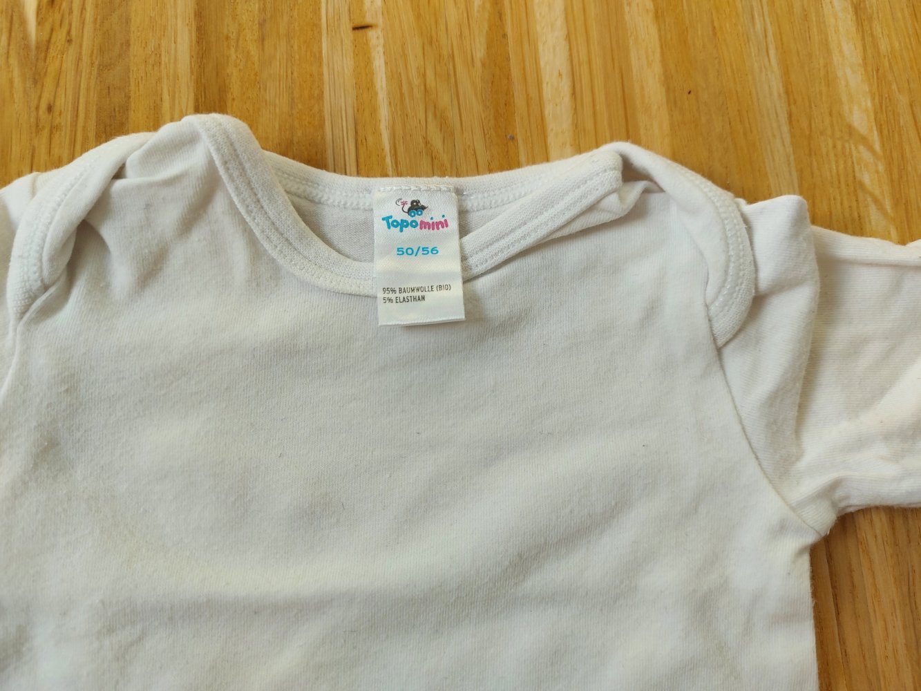 weißer Langarmbody Gr. 50/56