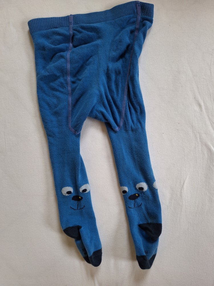 blaue Babystrumpfhose mit kleinen fröhlichen Gesichtern Gr. 74/80