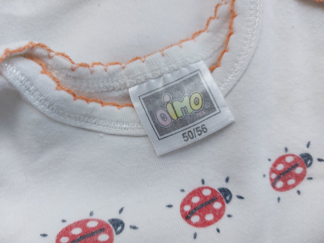 Niedlicher Kurzarmbody mit Mariechenkäfern Gr. 50/56