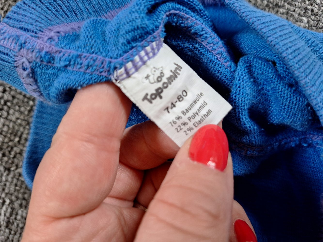 blaue Babystrumpfhose mit kleinen fröhlichen Gesichtern Gr. 74/80