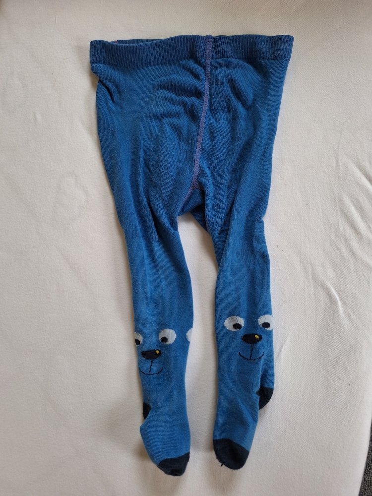 blaue Babystrumpfhose mit kleinen fröhlichen Gesichtern Gr. 74/80