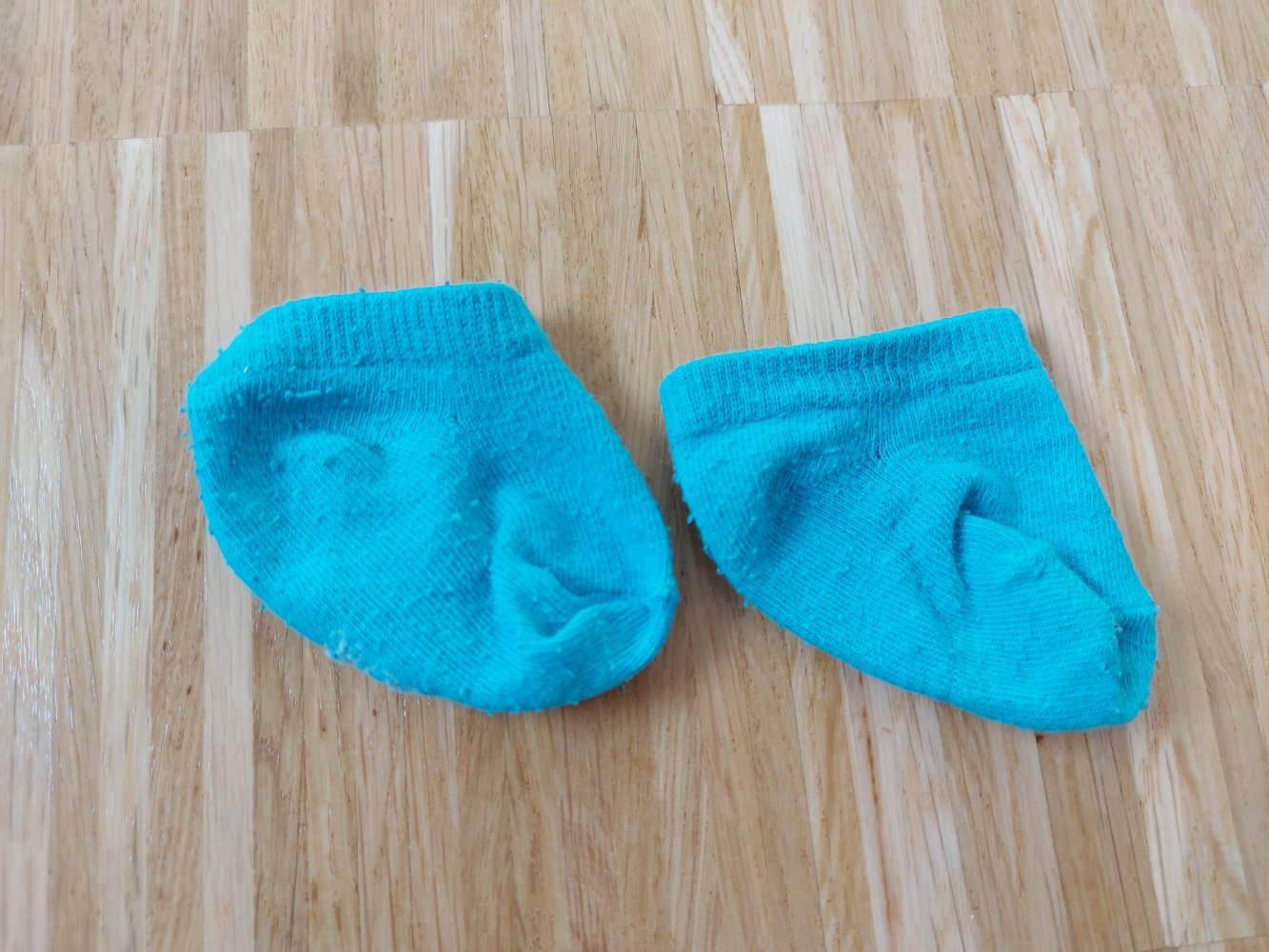 türkisfarbene Erstlingssöckchen / Babysocken